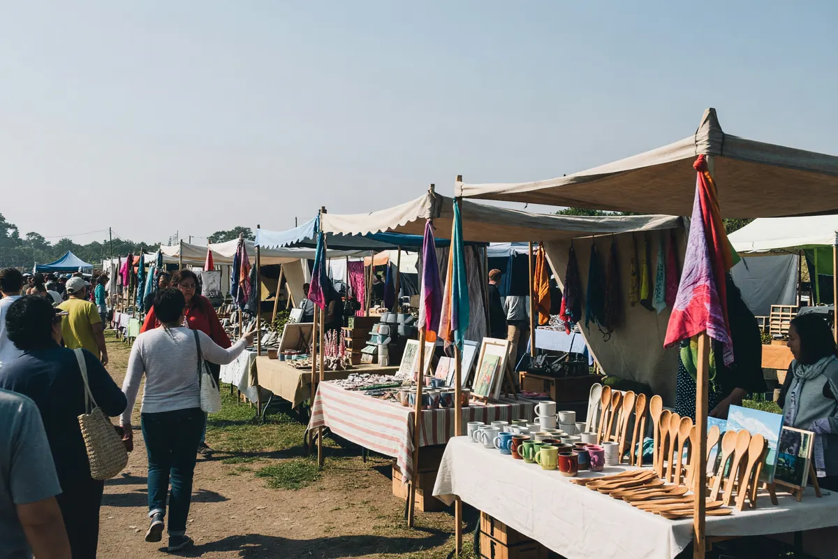 wide view of the fair stalls and crowd
