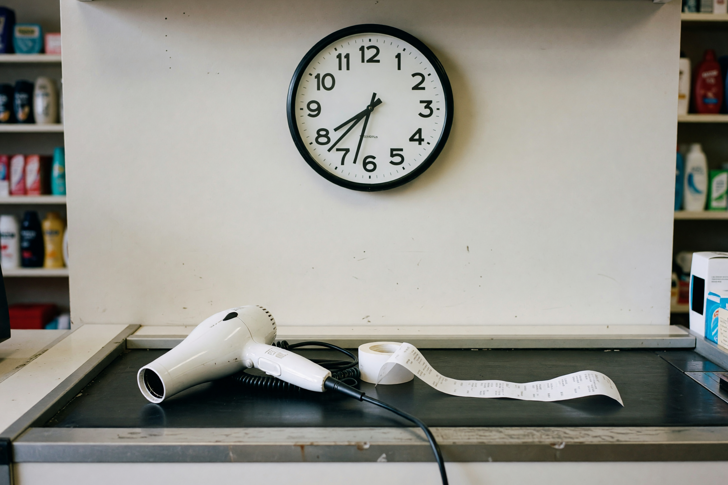 line at the register, clock on the wall