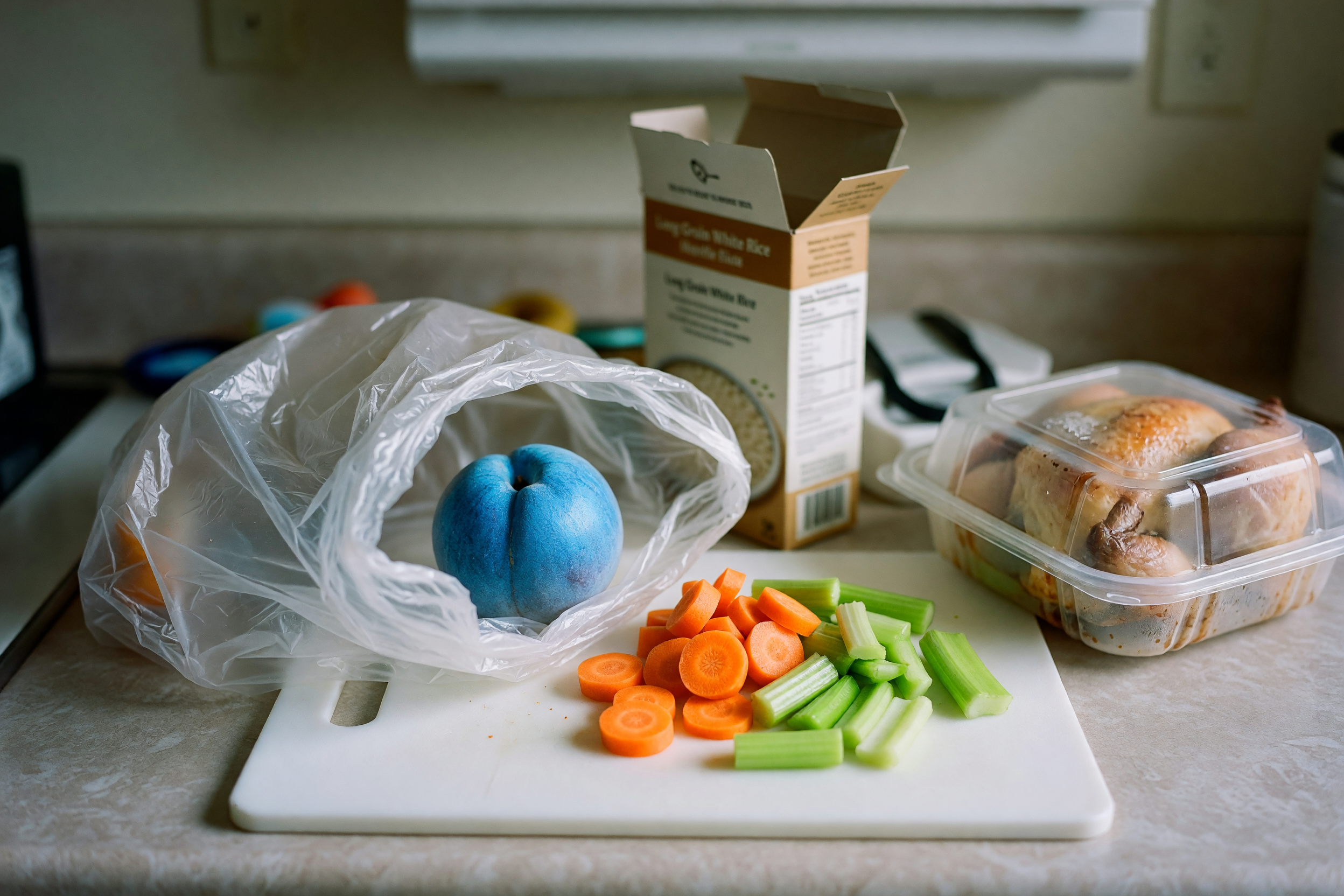 counter with groceries and a blue peach